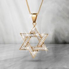 Research suggests that in the Middle ages the Star of David was common in various religious ceremonies. A symbol of faith and heritage this stylish stainless steel pendant is decorated with a double row of shimmering white Diamondeau®, the supreme diamond alternative, adding eye catching appeal. White Star Of David Jewelry For Anniversary, The Star Of David, Religious Ceremony, Star Of David Pendant, Diamond Alternatives, The Middle Ages, Star Of David, Stainless Steel Pendant, Middle Ages