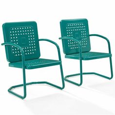 two green metal chairs with holes on the back and armrests, side by side