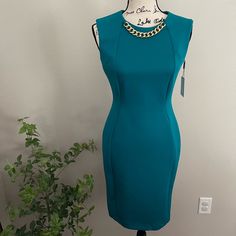 New! W/ Tag Size 2 Sleeveless Unlined Round Neckline Sheath Silhouette Scuba Crepe: Stretchy And Supportive Color: Turquoise 92% Polyester, 8% Spandex Dry Clean Tailored Fit Through The Chest, Waist And Hips; Sits Close To The Body 37" Length Hidden Back-Zip Closure Jewel Neck Elegant Sleeveless Stretch Dress By Calvin Klein, Elegant Stretch Sleeveless Dress By Calvin Klein, Elegant Calvin Klein Stretch Sleeveless Dress, Gingham Jacket, Striped Dress Summer, Black Party Dresses, Bow Detail Dress, Color Turquoise, Denim Maxi Skirt