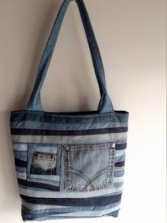 Denim Bag Denim Tote Bag Tote Patchwork Bag Recycled Bag Quilted Bag Denim Shoulder Bag Gift for Her Handmade patchwork quilted recycled denim bag with zipper, simple inside pocket pocket with zipper and pocket for mobile phone Made from recycled denim jeans and cotton lining. Measurements Strips Blue Recycled Denim Bag With Zipper Pocket, Blue Recycled Denim Shoulder Bag With Zipper Pocket, Blue Shoulder Bag With Zipper Pocket In Recycled Denim, Denim Patchwork Bag For Everyday Use, Denim Patchwork Tote Bag, Blue Jean Purses, Recycled Bag, Recycled Jeans Bag, Denim Handbag