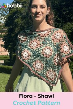 a woman wearing a crochet shawl with the words flora - shawl on it