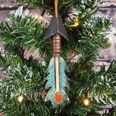 an ornament is hanging on a christmas tree