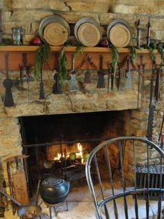 a fireplace with pots and pans on it