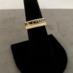 A slim stackable version of our Equus Enamel Ring. Beautiful combination of black enamel and 18 karat yellow gold. 4mm wide Equus (Latin for horse) Cheval (French for horse), stars and a snaffle bit in a continual pattern. Fine beaded detail on both edges. Absolutely gorgeous stacked with the Slim Lace Rein & Diamond Stack rings! Create your own combination! Hand made in the US Made to order, please allow 4-6 weeks for delivery. Luxury Black Stackable Rings For Anniversary, Elegant Adjustable Gold Enamel Ring, Designer Black Enamel Rings For Gift, Luxury Black Enamel Ring, Elegant Enamel Stackable Rings, Luxury Black Stackable Jewelry, Black Luxury Stackable Jewelry, Gold Enamel Ring With Black Detailing Fine Jewelry, Gold Enamel Ring With Black Enamel Fine Jewelry