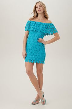 In playful Daisy crochet, this minidress will add a little flair to your next warm-weather getaway. This off-the-shoulder, cover-up dress features a flirty, open-lace top ruffle with a lined bodice for easy day-to-night outfit changes. Pair this off-the-shoulder cover-up dress with a bandeau swimsuit during the day - to keep that off-the-shoulder look, and simply add dressy sandals and statement earrings for dinner date attire. Off-the-shoulder top ruffle Slim fit Lined Pull-on style Runs small;