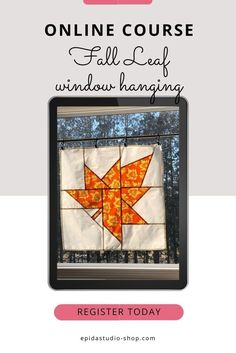 an orange and white quilt with the words online course fall leaf window hanging