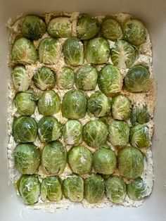 the brussel sprouts have been placed on top of each other in a baking dish