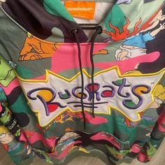 "Sometimes A Baby's Gotta Do What A Baby's Gotta Do." Rugrats Camo Hoodie Will Have You Reminiscing On All Your Favorite Babies. Cotton Camo Print Hoodie Rugrats Characters All Over Embroidered Rugrats Ligo 100% Authentic Size S Casual Green Hoodie With Logo Print, Multicolor Kangaroo Pocket Sweatshirt For Streetwear, Multicolor Streetwear Sweatshirt With Kangaroo Pocket, Multicolor Sweatshirt With Kangaroo Pocket For Streetwear, Multicolor Logo Print Sweatshirt For Winter, Multicolor Cartoon Print Hooded Hoodie, Winter Multicolor Sweatshirt With Logo Print, Winter Multicolor Logo Print Sweatshirt, Multicolor Hoodie With Kangaroo Pocket For Streetwear