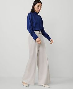 Our belted pleated wide-leg pant is a modern must-have, with a perfect drape and high waist that endlessly flatters. Front zip with double hook-and-bar closure. Belt loops. Self tie buckle belt. Front pleats. Front off-seam pockets. Back besom pockets,Leg Shape:Wide-Leg – a new must-have with a statement leg and flattering high waist,Rise:High rise: sits 1/2" to 1" below natural waist,Imported:Imported,Fit:Tailored & fitted,Length:Full length: 31" inseam with 26 1/2" leg opening,Fabrication:67% Fitted Wide Leg Pull-on Dress Pants, Fitted Cream Ankle-length Wide Leg Pants, Cream Ankle-length Wide Leg Pants With Pockets, White Non-stretch Ankle-length Wide Leg Pants, Cream Non-stretch Wide Leg Bottoms, Buckle Belt, Ann Taylor, Wide Leg Pants, Size 16