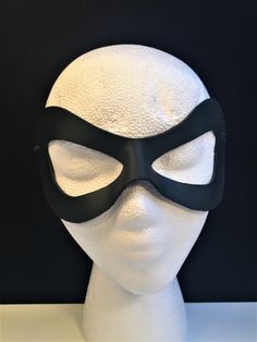 DESCRIPTIONAdd spice to your love life! This small, very lightweight, black leather mask is perfect for the beginner dominatrix or Lord of the Bedroom. Any color. Silver studs available. Waterproofed leather, glossy or matte finish, & several choices to affix the mask (cord, elastic, ribbon, waterproof cord, stick, or no holes for adhesive). Measurements: 3" high x 7" wide (tallest & widest points); 1" high between the eyes; 2.75" wide x 2.75" tall eye openings ---------------------------------- Lone Ranger Costume, Splatoon Costume, Mask Cord, Robin Superhero, Comicon Costume, Ranger Costume, New Years Eve Ball, Robin Cosplay, Black Wear