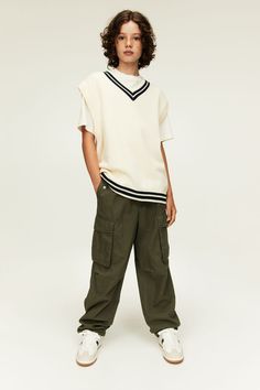 Loose-fit pants in woven cotton fabric. Elasticized waistband and mock fly with snap fastener. Front pockets with flap and concealed snap fastener  leg pockets with flap  and pleats at knees for added width. Straight legs with an elastic drawstring at hems. Casual Wide-leg Pants With Flap Pockets, Casual School Pants With Elastic Waistband, Casual Pants With Elastic Waistband For School, Sporty Cotton Bottoms For School, Casual School Bottoms With Side Pockets, Cotton Bottoms With Elastic Waistband For School, Casual Cotton Bottoms With Flap Pockets, Casual School Pants With Side Pockets, Casual Pants With Side Pockets For School