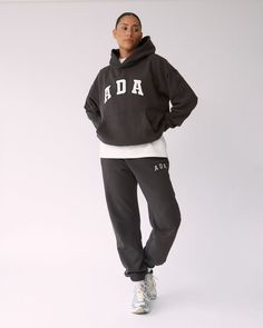 Athleisure Sweats With Drawstring Hood For Lounging, Sportswear Sweatpants With Letter Print For Loungewear, Athleisure Letter Print Joggers For Loungewear, Athleisure Joggers With Letter Print For Loungewear, Oversized Athleisure Joggers For Lounging, Letter Print Joggers For Loungewear, Oversized Sporty Joggers For Lounging, Athleisure Joggers With Letter Print And Relaxed Fit, Sporty Letter Print Sweatpants For Loungewear