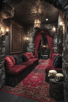 a living room filled with lots of red couches next to a stone wall covered in skulls