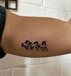 three horses tattoo on the arm