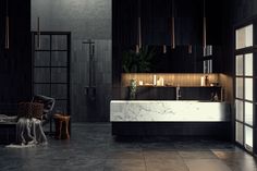 a modern bathroom with marble counter tops and black walls, along with candles on the wall