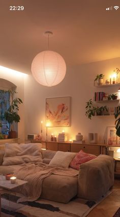 a living room filled with furniture and lights