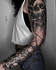 a woman with a black and white tattoo on her arm