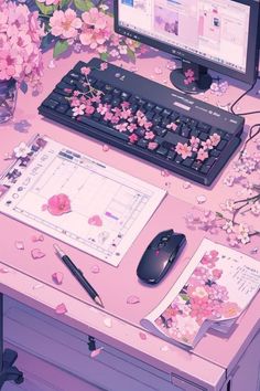 a desktop computer sitting on top of a desk next to a keyboard and mouse with pink flowers