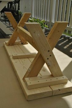 a wooden bench sitting on top of a patio