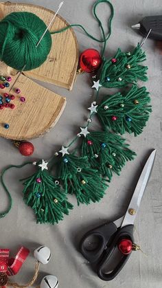 scissors, yarn and other crafting supplies on a table