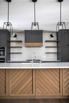 a kitchen with wooden cabinets and white counter tops, along with open shelving on the wall