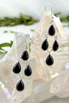 Connect with your inner natural beauty with our authentic Black Onyx Earrings - Dew Drops. Sleek, stylish and feather-light, these pretty dangle earrings reflect the effortless beauty that comes from within. A statement such as our Dew Drops will take you from airy summer picnics to cozy winter get-togethers in style. A striking addition on their own or matched with your Dew Drops Necklace, these enchanting earrings are sure to become a favorite. Authentic Sivalya Black Onyx Black Onyx: Enduranc Elegant Black Long Drop Chandelier Earrings, Black Sterling Silver Chandelier Dangle Earrings, Black Sterling Silver Dangle Chandelier Earrings, Pretty Dangle Earrings, Pretty Earrings Dangle, Drops Necklace, Summer Picnics, Black Onyx Earrings, Effortless Beauty