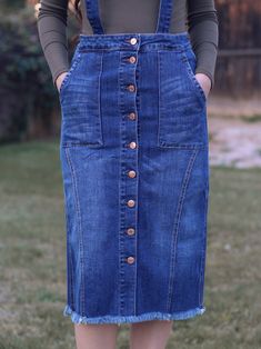 Our Remi Overall Skirt is a stunning button down denim skirt with a distressed hem and a unique overall detail that add a fun touch to an already beautiful skirt! Details FINAL SALE Functional buttons 4 pockets has stretch 98% cotton, 2% spandex Sizing (measurements are approximate) Small - 26" waist | 33" hips | 27" length Medium - 28" waist | 35" hips | 27" length Large - 30" waist | 37" hips | 27" length 1X-Large - 32" waist | 40" hips | 27" length 2X-Large - 34" waist | 42" hips | 27" length Stretch Cotton Denim Skirt Knee-length, Medium Wash Cotton Knee-length Denim Skirt, Knee-length Denim Skirt With Button Closure, Button Down Denim Skirt, Adidas Skirt, Medium Wash Button-up Denim Skirt With Snap Buttons, Non-stretch Cotton Denim Skirt With Button Closure, Denim Button Skirt, Diy Skirts