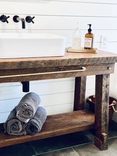 a bathroom with two towels and a sink