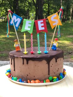 a birthday cake with candles and decorations on it