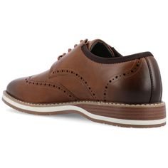 Introducing the Ozzy derby by Vance Co. These classic shoes are made with high-quality vegan leather, offering a professional and timeless style. With a comfortable 12 mm Tru Comfort Foam™ insole and a lace-up design, they provide all-day comfort and a secure fit. The 1-inch block heel, round-toe shape, and wingtip detailing add a touch of sophistication to the Ozzy derby, making it a versatile and stylish choice Brown Lace-up Shoes With Goodyear Welt For Business Casual, Classic Fitted Synthetic Oxfords, Brown Lace-up Shoes With Leather Footbed For Business Casual, Classic Oxfords With Rubber Sole And Synthetic Material, Classic Synthetic Dress Shoes For Workwear, Classic Synthetic Dress Shoes For Work, Brown Synthetic Oxfords For Work, Brown Brogue Oxfords For Business Casual, Synthetic Brogue Dress Shoes For Work