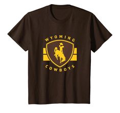 PRICES MAY VARY. Fan favorite Wyoming Cowboys kid's apparel short sleeve shirt that is a great addition to any Wyoming fans wardrobe, making it a perfect gift for Christmas or graduation This Wyoming kid's short sleeve shirt has a high quality digitally printed graphic perfect for any Cowboys fan that loves the classic design. Each shirt is officially licensed by University of Wyoming Lightweight, Classic fit, Double-needle sleeve and bottom hem Cowboys Apparel, University Of Wyoming, Wyoming Cowboys, Cowboy Outfits, Stripe T Shirt, Gift For Christmas, Kids Shorts, Wyoming, Short Sleeve Shirt