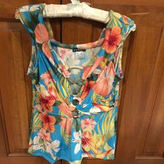 Pretty And Sexy Neck Line On This Blouse. Three Gold Colored Hoops Make Up The Plunging Neck Line. Really Cute. Tropical Flower Pattern. Nwot. Never Worn. Tropical Flowers Pattern, Plunging Neck, Sleeveless Blouse, Tropical Flowers, Gold Color, Top Blouse, Womens Tops, Yellow, Women Shopping