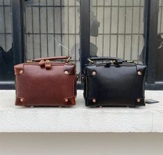 MATERIAL - Made of 100% high quality full-grain leather (Italy vegetable-tanned leather), solid color, feels cosy to touch,delicate, durable. The hardware parts are made of cast molding thick hardware, top metal hardware. The stitching is well-made, firm and smooth. YKK zipper.DIMENSIONS - 5.5L*3.5W*7.9H(inch) / 14L*9W*20H(cm)STRUCTURE - This handbag contains 1 main compartment, 1 inner slip pocket. Comfortably holds wallet, mobile phone, cosmetics, keys, charge, essentials and so on.FUNCTIONAL Rectangular Office Bags With Brass Hardware, Brown Top Handle Shoulder Bag With Brass Hardware, Brown Top Handle Satchel With Metal Hardware, Vintage Leather Shoulder Bag With Gunmetal Hardware, Classic Brown Bags With Metal Hardware, Luxury Brown Shoulder Bag With Gunmetal Hardware, Brown Business Shoulder Bag With Gunmetal Hardware, Classic Leather Box Bag With Metal Hardware, Brown Rectangular Shoulder Bag With Gunmetal Hardware