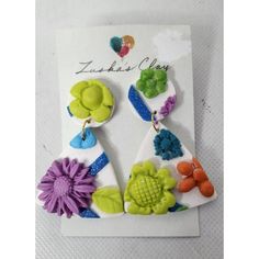 Title: Zuska's Clay Earrings Boho Floral Raised Design Handmade Clay Colorful 2.5"New Brand: Zuska's Clay Pattern: Floral Featured Refinements: Bohemian, Colorful, Raised Design, Handmade, Dangle Modified Item: No Condition: Brand New Condition Measurements Length: 2.5" We Want You To Have A Positive Experience. Please Examine The Pictures Carefully Before Purchasing! Thank You! Trendy Purple Flower Earrings For Gift, Handmade Purple Flower Earrings Whimsical Style, Handmade Purple Whimsical Flower Earrings, Purple Handmade Whimsical Flower Earrings, Purple Flower-shaped Earrings, Whimsical Handmade Purple Earrings, Trendy Handmade Purple Earrings, Handmade Multicolor Earrings For Birthday, Handmade Green Earrings For Birthday