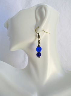 Beaded Dark Blue Drop Earrings 1.5” in length, lightweight earrings in beautiful blues! Made with glass beads and brass-layered ear-hooks and bead caps. These Beaded Dark Blue Drop Earrings will ship to you in a gift box, securely mailed in a padded envelope. Shipping same or next day, thru USPS Ground Advantage, tracking and insurance included. Once mailed, you can track your package at USPS.com. If you don’t love your new treasure, you have 30 days to return it. Go back to Beaded Earrings. Bright Outfit, Blue Drop Earrings, Colorful Jewelry, Lightweight Earrings, Beaded Accessories, Bead Shop, Light Weight Earrings, Hand Made Jewelry, Bead Caps