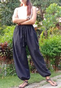 "The harem style trousers made from cotton fabric 100%with an elasticated smock waist and ankles they provide a comfortable lightweight fit, perfect for casual wear, festivals, yoga, holidays as well as pairing with a plain top to get that popular look. Materials: Cotton,Polyester Sizing: One size fits most. Size : (inches) ✿Waist 24\" (61 cm) stretching to 46\" (elastic material) (116 cm) ✿ Hip 30\"- 48\" ( 76-121 cm ) ✿ Length 40\" ( 101 cm ) ✿ Length around each legs: 10\" (25 cm) can be stre Casual Ankle-length Harem Pants For Loungewear, Casual Cotton Harem Yoga Pants, Casual Harem Parachute Pants For Yoga, Loosely Fitted Cotton Harem Pants For Meditation, Cotton Hippie Harem Pants For Meditation, Hippie Cotton Harem Pants For Meditation, Baggy Cotton Yoga Pants For Festival, Casual Ankle-length Harem Pants For Yoga, Casual Ankle-length Harem Yoga Pants