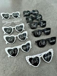 sunglasses with the names of bride and groom written on them, all in black and white