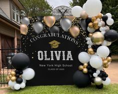 balloons and confetti decorate the entrance to an university graduation party in new york