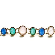 A stunning collection of Venetian glass cameo/intaglios in lapis blue, emerald green and blush pink, have been married together to create this classic bracelet. Each of the gorgeous intaglios/cameos sits in bezeled mountings accented with a twisted border made of gold vermeil. This neoclassical design is simultaneously understated and dynamic with it’s simple classic designs and coloring. This jaw-dropping bracelet with roots in the Byzantine era, will quickly become a favorite due to its classi Formal Blue Bracelets With Cabochon, Oval Cabochon Bracelet For Wedding, Oval Cabochon Wedding Bracelet, Elegant Glass Jewelry With Cabochon, Elegant Bracelets With Natural Stones, Elegant Oval Glass Jewelry, Elegant Natural Stones Oval Bracelet, Luxury Glass Jewelry For Formal Occasions, Elegant Glass Bracelet Jewelry