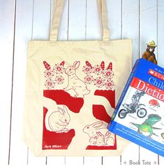 "Hole Rabbit" Tote bag Art Mina Eco-friendly cotton tote bag was Illustrated and hand-printed on Silk Screen by Mina Wilcox with joy from her small Art Studio in California. This Art Mina heavy canvas shopping tote will hold multiple gifts or groceries. = Hole Rabbit =They have a playroom, a powder room, and a nursery.DETAILS: One Heavy Canvas Tote Bag + Book Tote + Size: 15"W x 15"H x 4"D (W38cm x H38cm x D10cm) Full side and bottom gusset: 4" (D10cm) Self Fabric handles: 24" (61cm) + Jumbo Tot