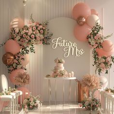 a table with cake, flowers and balloons in front of a wall that says future mrs