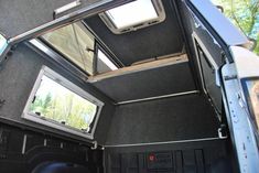 the interior of an rv with two windows and no roof is shown in this image