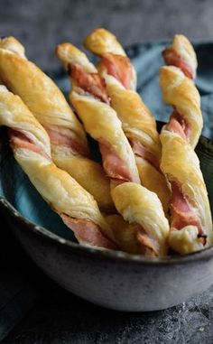 bacon wrapped pretzels in a bowl on a table