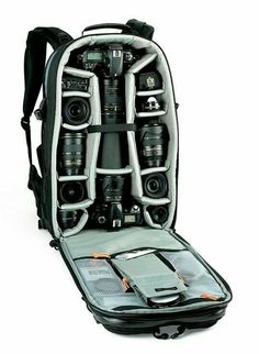 an open backpack with cameras in it