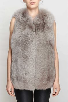 Crafted from super-soft fox fur, this gilet is the perfect winter layer for glamorous ladies. Fastened with a concealed hook-and-eye fastening, layer the plush piece over a long-sleeved dress and woolly tights for an adorable autumnal party ensemble, or with jeans and ankle boots for a casual stylish look Autumnal Party, Lux Fashion, Mongolian Lamb, Women Crafts, Star Fox, Winter Layering, Sleeved Dress, Casual Stylish, Vest Outfits