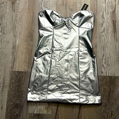 Metallic Tube Mini Dress. Size 8. Brand New! Silver Strapless Summer Dress, Silver Strapless Dress For Summer, Metallic Strapless Dress For Date Night, Strapless Metallic Dress For Date Night, Metallic Shiny Mini Dress, Metallic Shiny Mini Length Dress, Metallic Strapless Mini Dress For Party Season, Strapless Metallic Mini Dress For Party Season, Spring Metallic Shiny Mini Dress