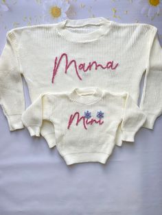 ★ Matching Hand Embroidered Mama & Mini Sweater, Mommy and Me Outfits, Mom and Me Sweater, Dada, Auntie, Grandma, Babe, Baby Sweater ★These sweaters are meant to be OVERSIZED. You can always roll the sleeves up and have your little one grow into these so you can get more use out of it! Customize your sweater with the name or word you would like for it to say. If you give two names or words it will be one below the other. Select the color you would like the name in different yarn color options. ★ I wanted to share these lovely photos 📷  taken by my previous customer, Jenn Turkcan. 😍 You should definitely check out and follow her Instagram account. Trust me, her page is flooded with the cutest posts ever! ❤️ @lattesandlullabies ❤️ ★ Personalization: Please write: 1. Name (or age or word) t White Tops With Embroidered Graphics For Mother's Day, White Embroidered Tops For Mother's Day, Custom Embroidered White Tops For Mother's Day, Cute White Sweater With Embroidered Text, Embroidered White Tops For Mother's Day, White Cute Sweater With Embroidered Text, White Tops With Letter Embroidery For Mother's Day, Cute White Embroidered Sweater, Mink Colour