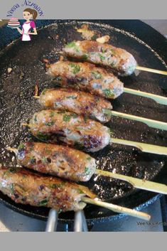 chicken skewers being cooked in a skillet