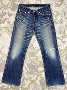 33X30 Distressed Blue Vintage Levi's 708 Jeans JN 1936 Size: 33 Actual measurement (inches): Waist - 33 Front Rise - 9.5 Hips - 40 Thigh - 11.5 Knee - 7.5 Leg Opening - 18 Inseam - 30 Outseam - 40.5 Material : Cotton  *Disclaimer: Product color may slightly vary due to photographic lighting sources or your monitor settings.  #JN1936 Classic Blue Distressed Jeans, Classic Distressed Faded Jeans, Classic Faded Distressed Jeans, Classic Distressed Dark Wash Jeans, Classic Dark Wash Distressed Jeans, Faded Denim, Grunge Style, Blue Vintage, Photographic Lighting