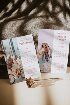 two bridesmaid cards sitting on top of a table